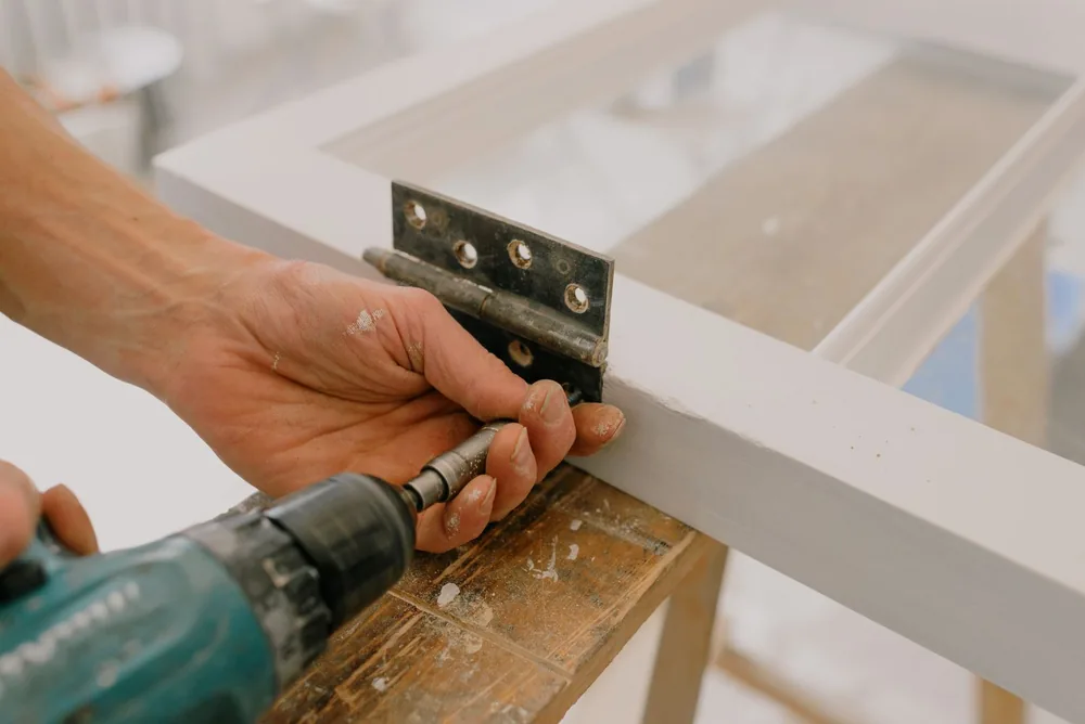 Fitting a new hinge to a window frame