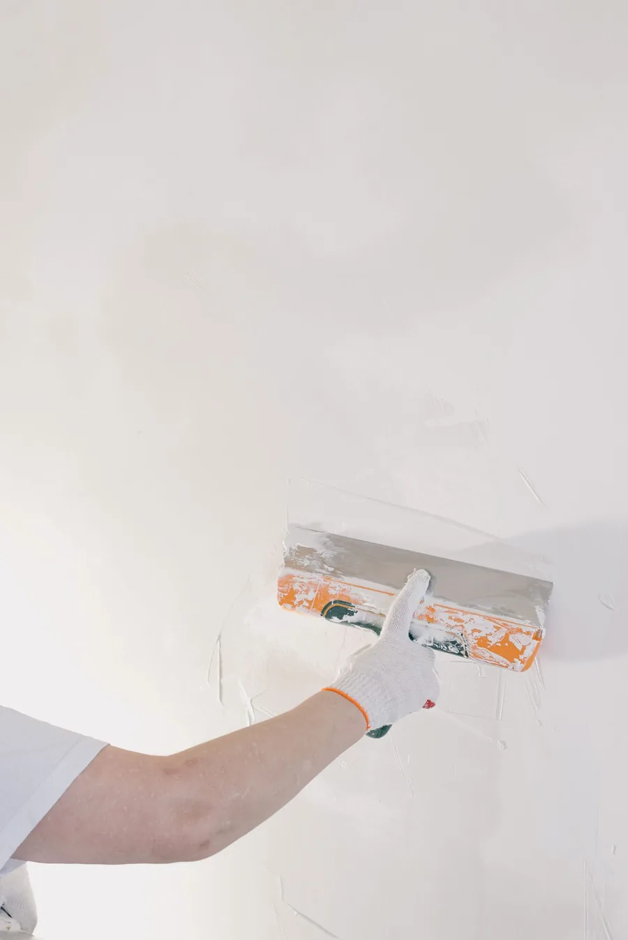Wall being treated and replastered after damp